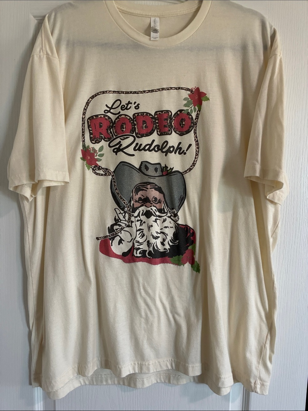 Next Level Apparel Cream 'Let's Rodeo Rudolph!' Graphic Tee with Red Accents